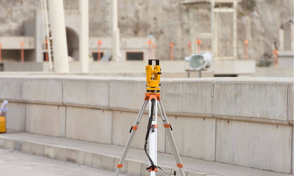 Surveying equipment set up for an ALTA Title Survey to provide accurate land details for property sales

