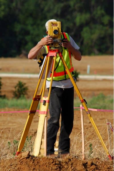  Licensed surveyor conducting a boundary survey in Las Vegas, Nevada using precision equipment on site.
