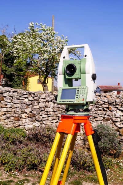 Boundary line survey equipment after flood - ALTA SURVEY Nevada Surveying equipment set up to check property boundaries after flood damage