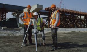 Post quake check - ALTA SURVEY Nevada Surveyors checking control points with a total station at a bridge construction site during a construction staking survey